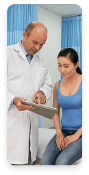 Physician reviewing clinical trial results with a participant on a tablet